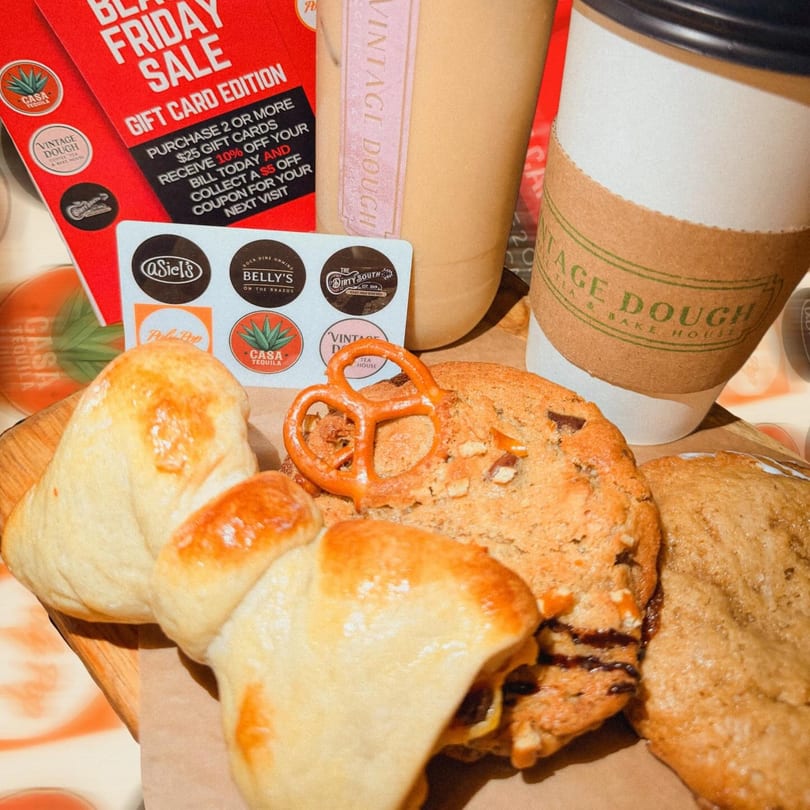 Vintage Dough pastries, cookies, and drinks with a Black Friday gift card sale flyer.